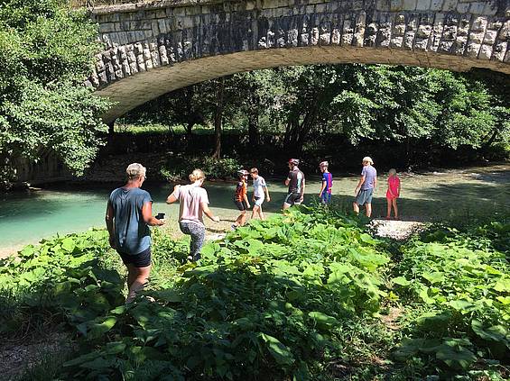 Biking along a river with Slow Trips